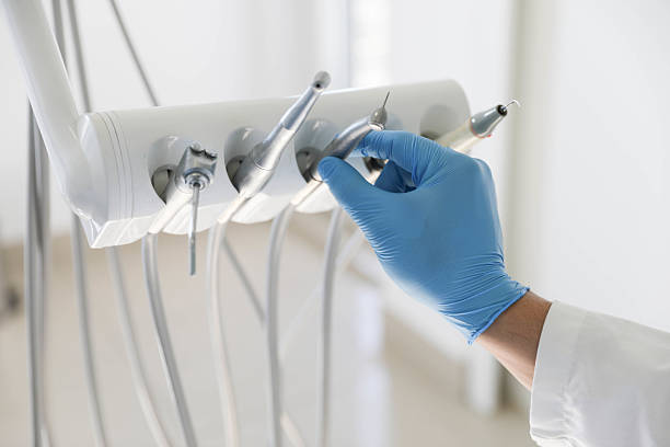 Professional Tooth Extraction technician working in Forest Glen, MD